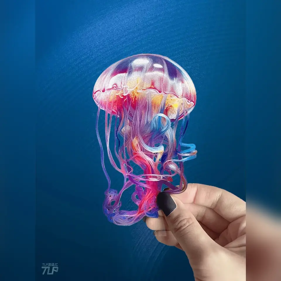 colorful jellyfish sticker held against blue background