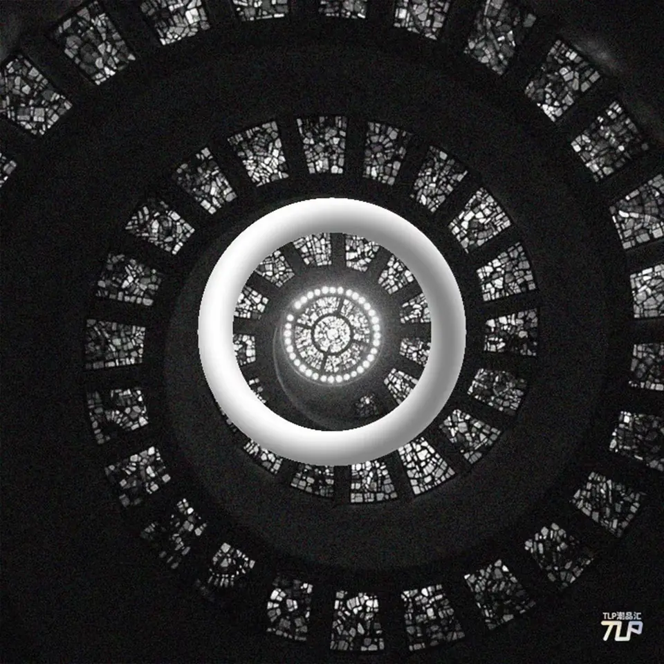 floating ring over circular architectural mosaic