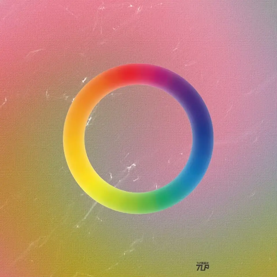 rainbow ring sticker over pink and green surface