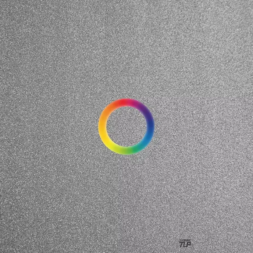 small rainbow ring sticker over silver surface